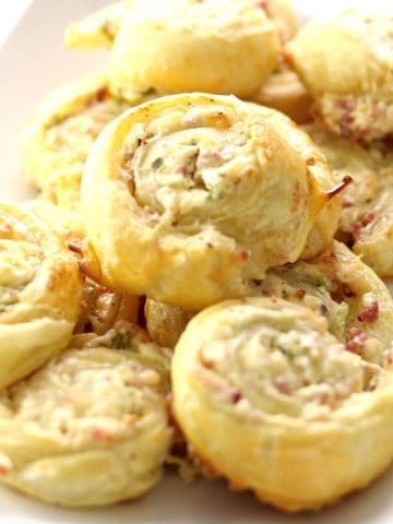 Puff Pastry Pinwheels on a white square plate.