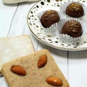 German gingerbread cookies next to a German Lebkuchen